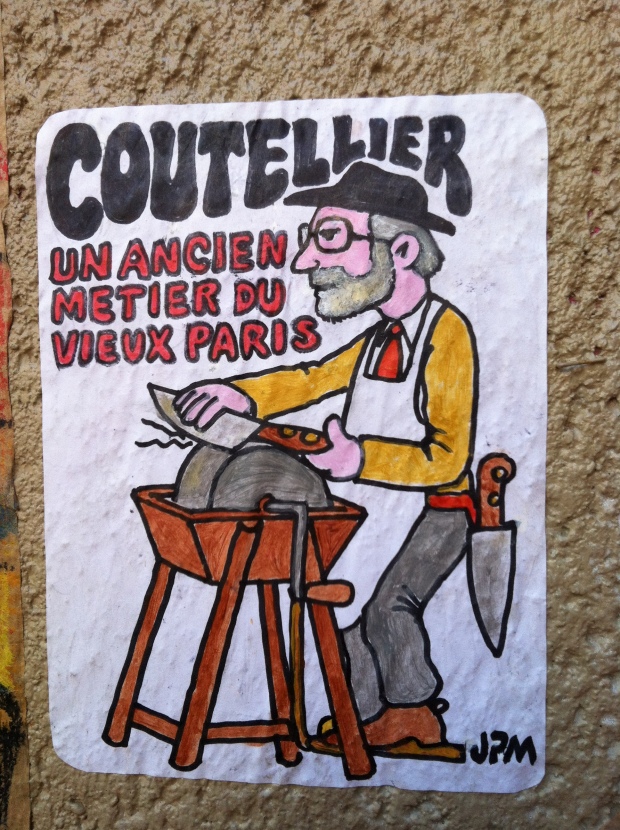 "Coutellier," JPM (a play on someone's name and the word for "knife-grinder"). Rue de la Forge Royale, Dec 11 '12.